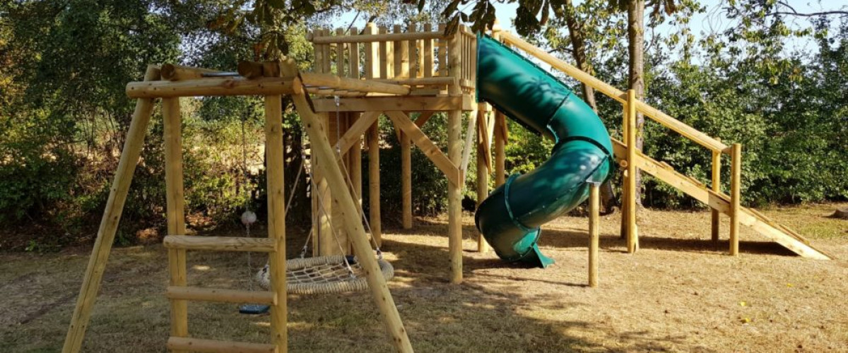 basket monkey bar swing set attached to zip wire platform