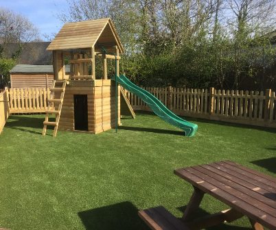 Artificial grass under wooden climbing frames