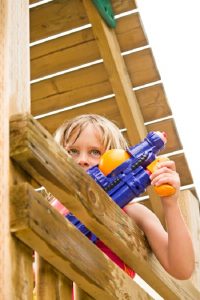 water fight in wooden climbing tower