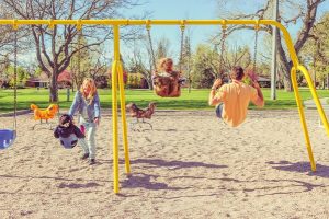 Family on Swings Together