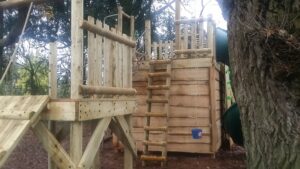 Tower, hide out zip wire, fireman pole, ladder, bucket, tube slide